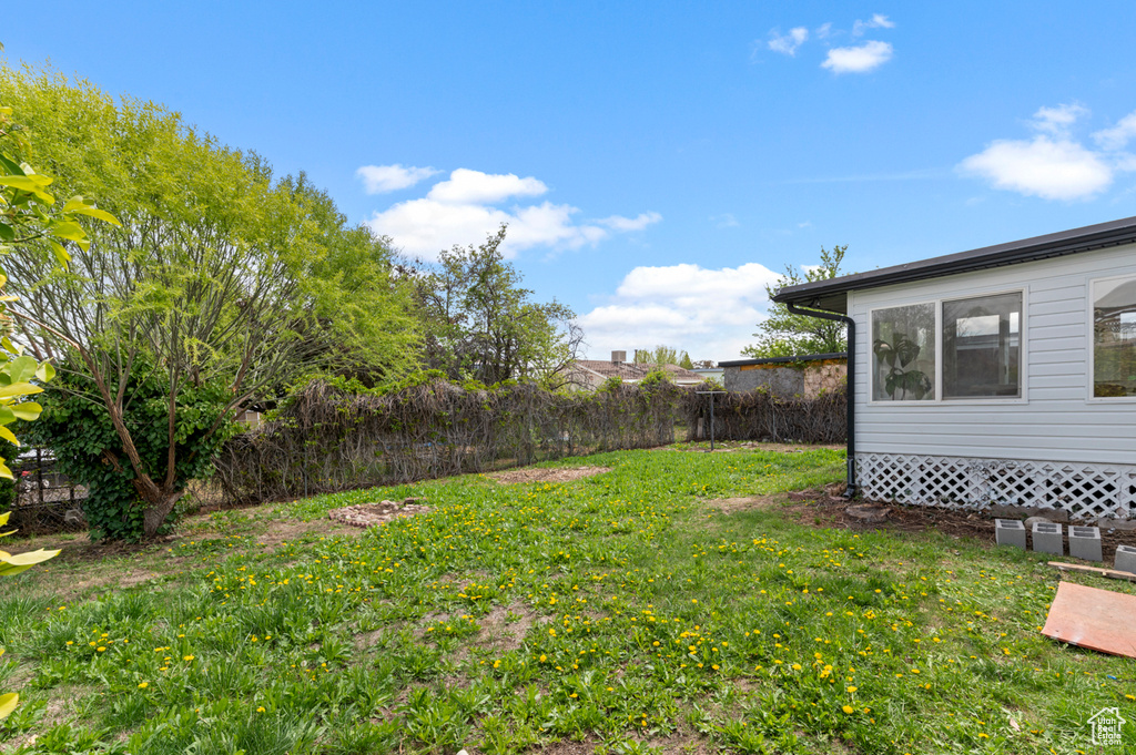 View of yard with fence