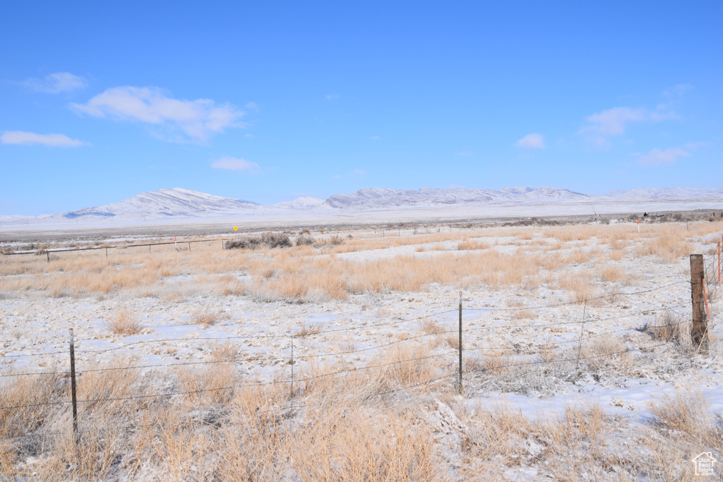 Property view of mountains with a rural view
