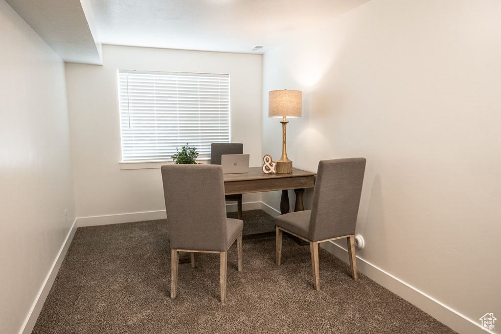 Home office featuring carpet floors and baseboards