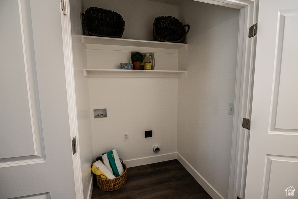 Clothes washing area with laundry area, baseboards, hookup for a washing machine, dark wood-style floors, and hookup for an electric dryer