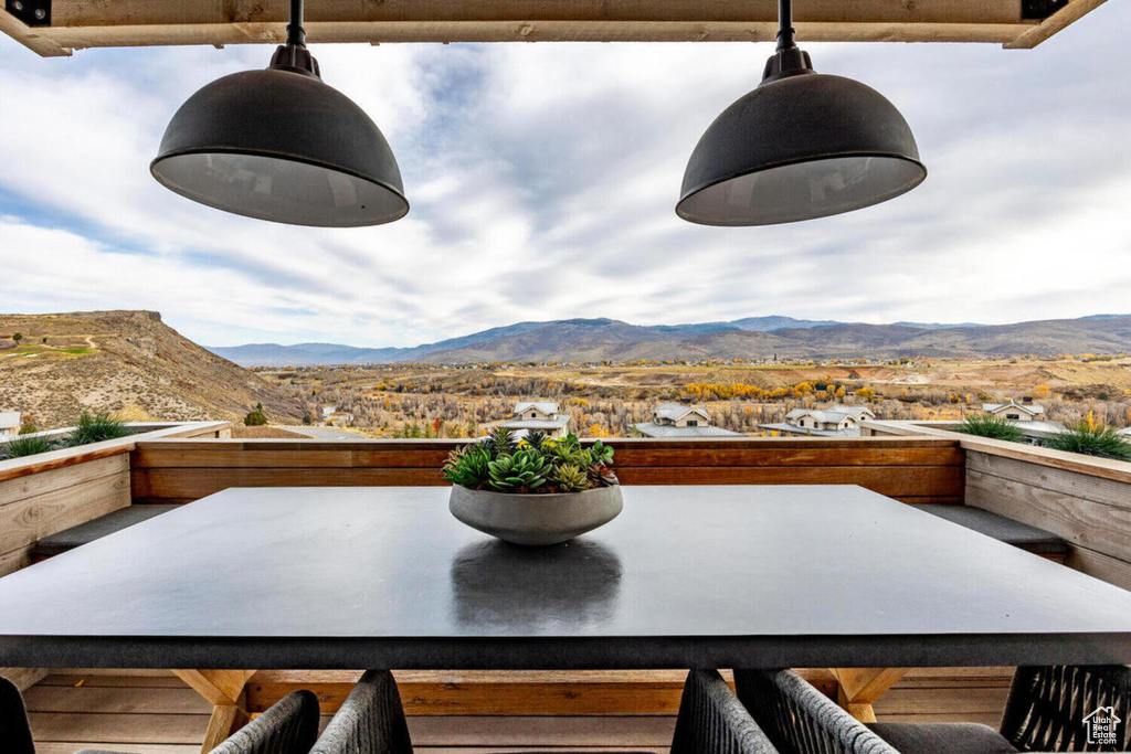 View of patio / terrace with a mountain view and a balcony