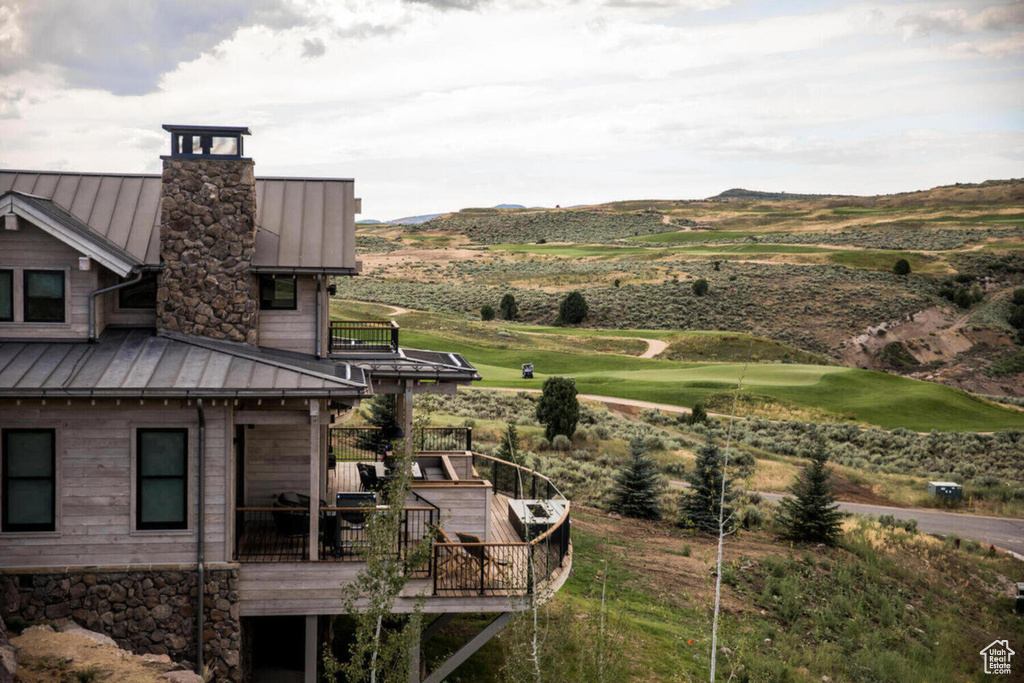 Exterior space featuring a deck with mountain view