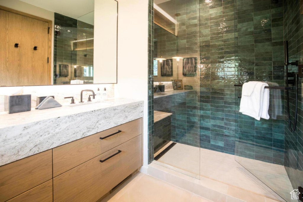 Bathroom with vanity and a stall shower