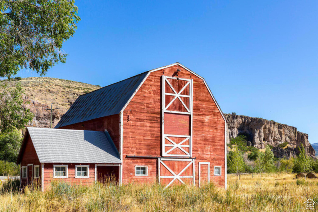 View of barn featuring a mountain view