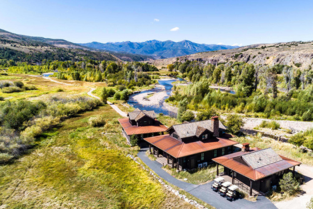 Birds eye view of property with a mountain view