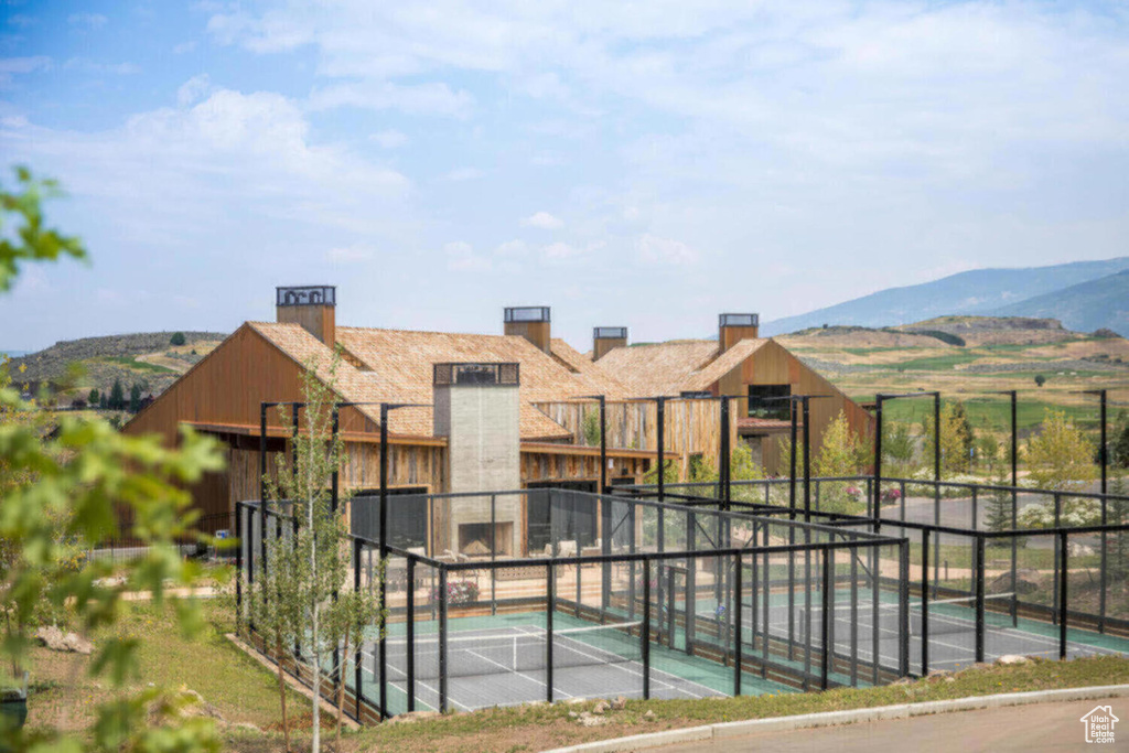 View of pool featuring fence and a mountain view
