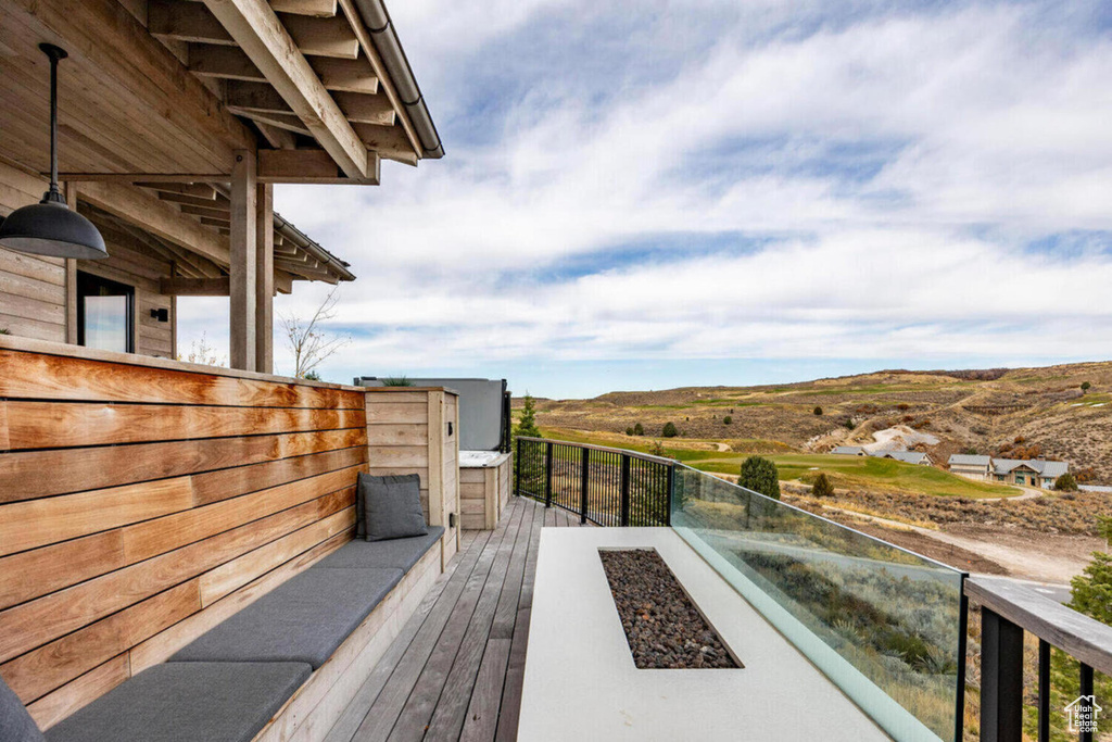 Wooden deck featuring a mountain view
