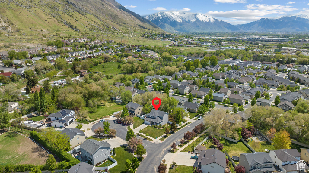 Birds eye view of property with a mountain view and a residential view