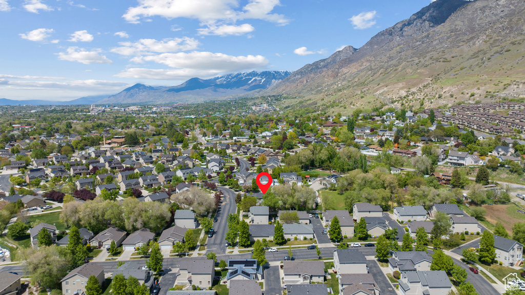 Birds eye view of property with a residential view and a mountain view