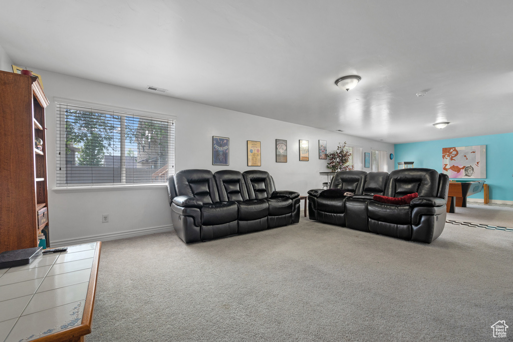 Living room featuring carpet floors, baseboards, and visible vents
