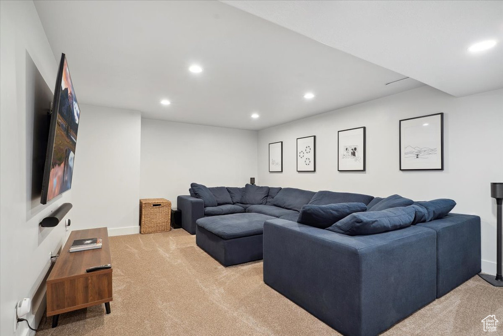 Living area with baseboards, light carpet, and recessed lighting