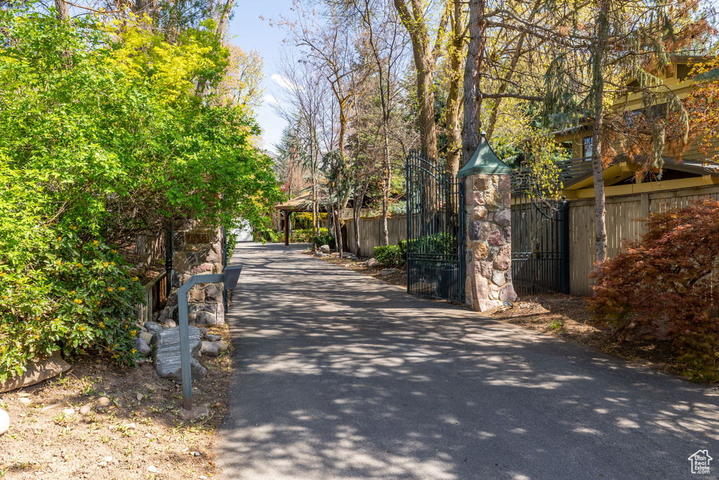 View of home\\\'s community featuring fence and a gate
