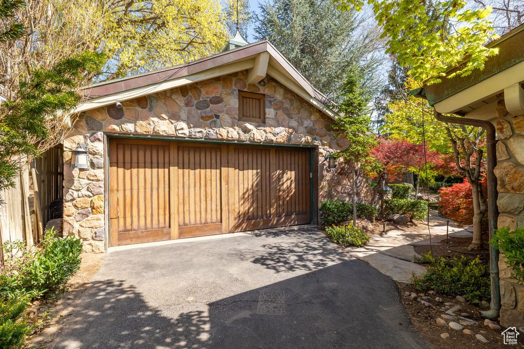 Exterior space featuring concrete driveway