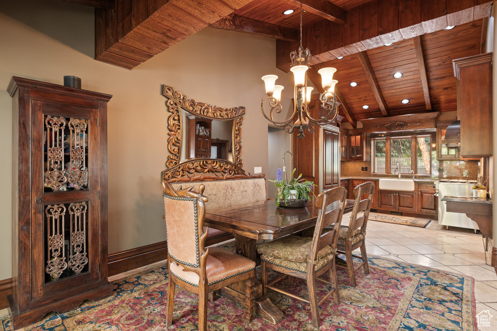 Dining room with wooden ceiling, an inviting chandelier, vaulted ceiling with beams, recessed lighting, and light tile patterned flooring