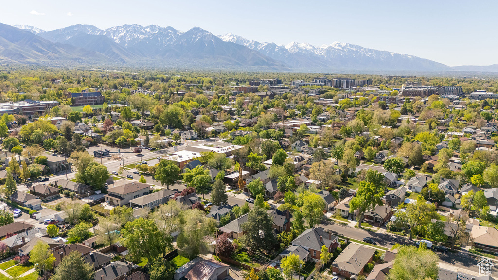 Birds eye view of property with a mountain view