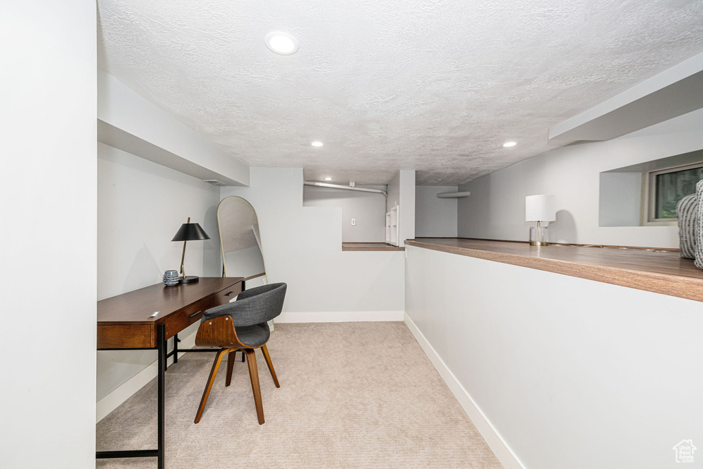 Office featuring recessed lighting, a textured ceiling, baseboards, and carpet