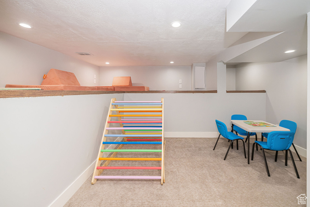 Rec room featuring carpet flooring, recessed lighting, baseboards, and visible vents