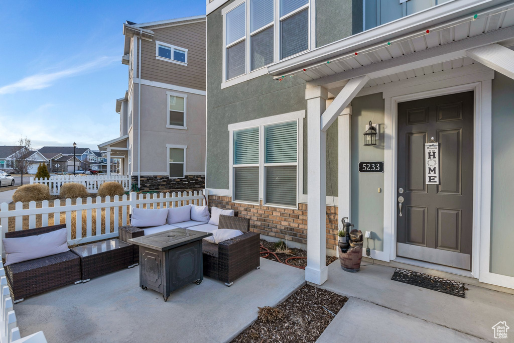 View of patio / terrace featuring fence and an outdoor hangout area