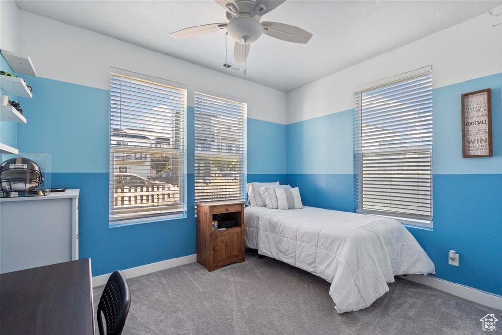 Bedroom featuring carpet flooring and ceiling fan