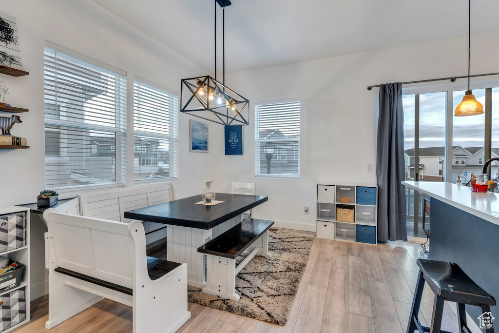 Dining room featuring a chandelier and light wood-type flooring