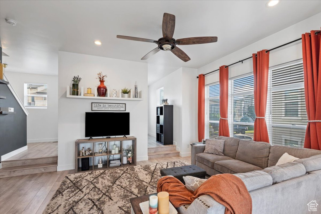 Living area with ceiling fan, recessed lighting, and wood finished floors