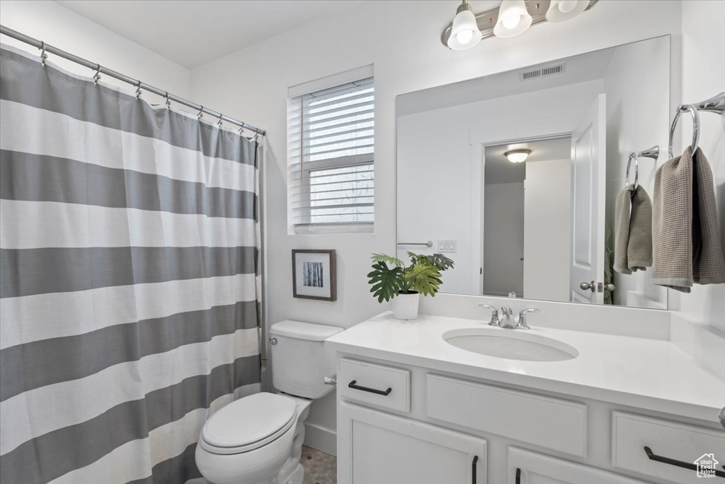 Full bathroom with vanity and a shower with curtain