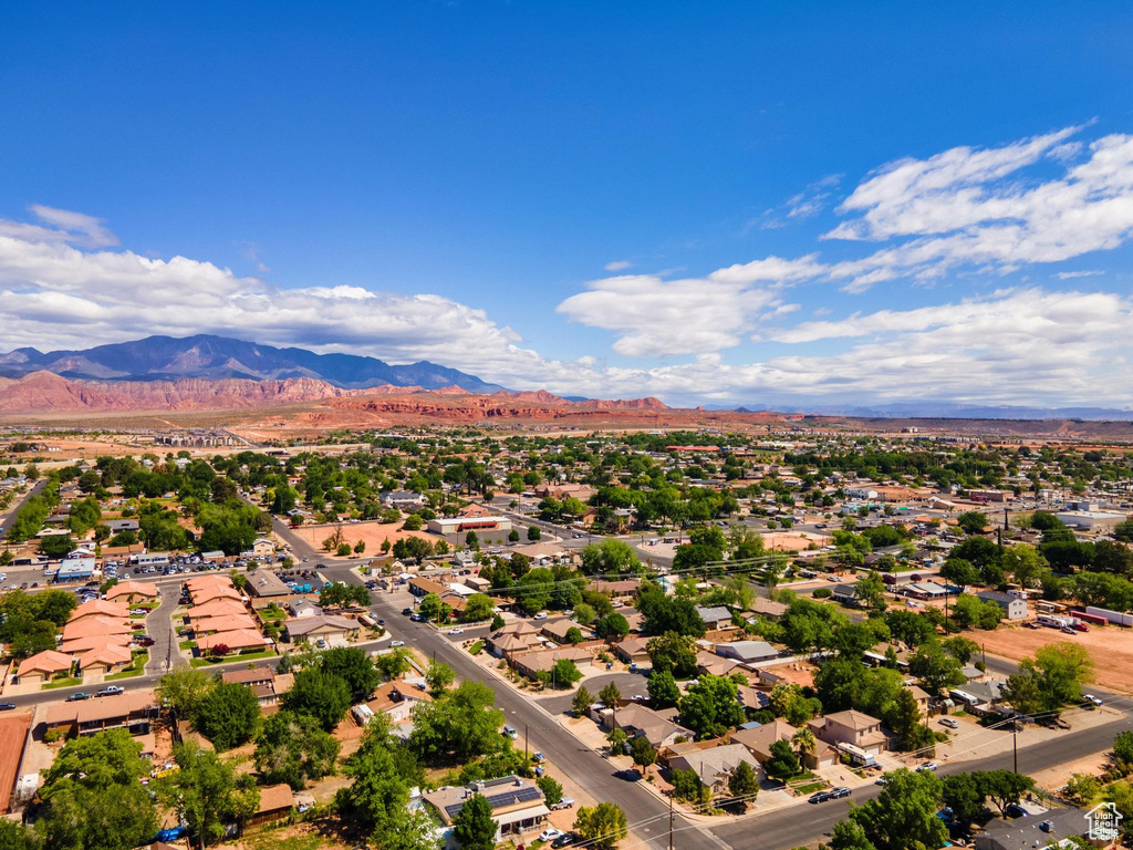 Birds eye view of property featuring a mountain view and a residential view