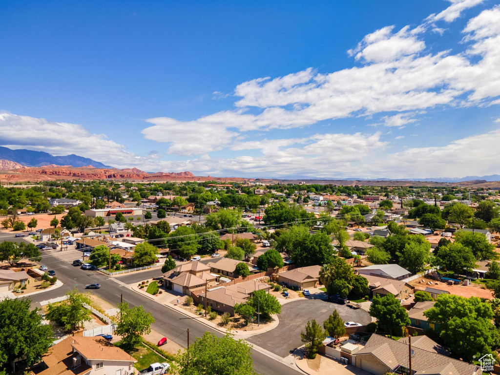 Birds eye view of property with a mountain view and a residential view