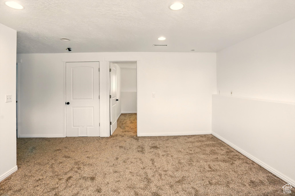 Interior space with baseboards, recessed lighting, and visible vents
