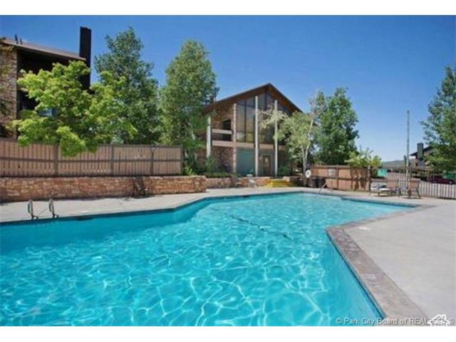 View of pool with a fenced backyard and a fenced in pool