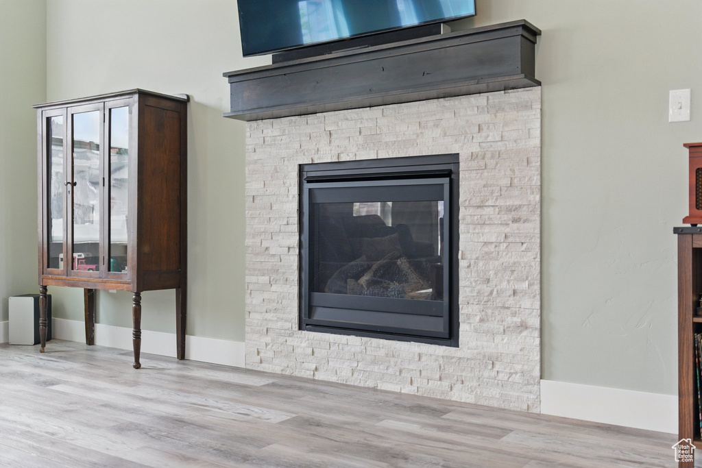 Details with baseboards and wood finished floors
