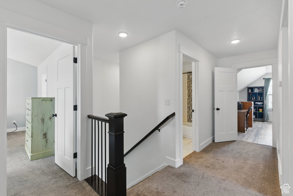 Hallway with recessed lighting, baseboards, an upstairs landing, and carpet