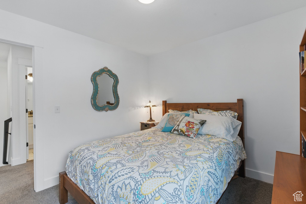 Bedroom featuring baseboards and carpet flooring