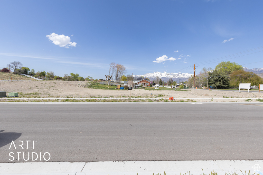 View of street featuring sidewalks and a mountain view