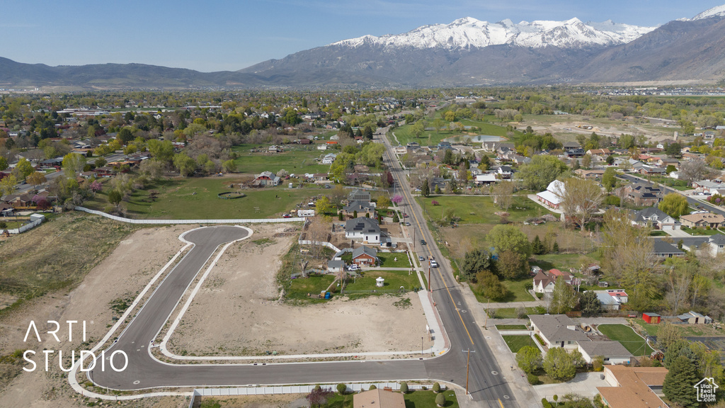 Birds eye view of property with a residential view and a mountain view