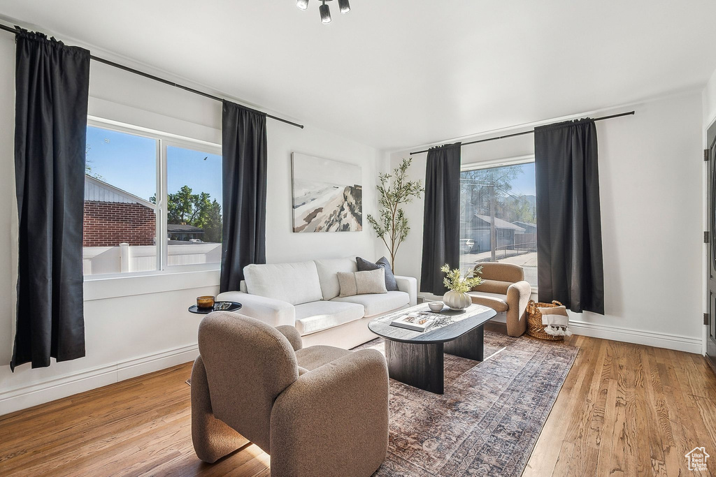 Living room featuring baseboards and wood finished floors