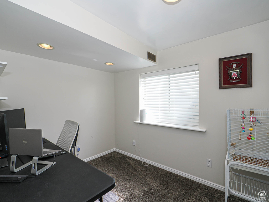Carpeted office space with recessed lighting, baseboards, and visible vents