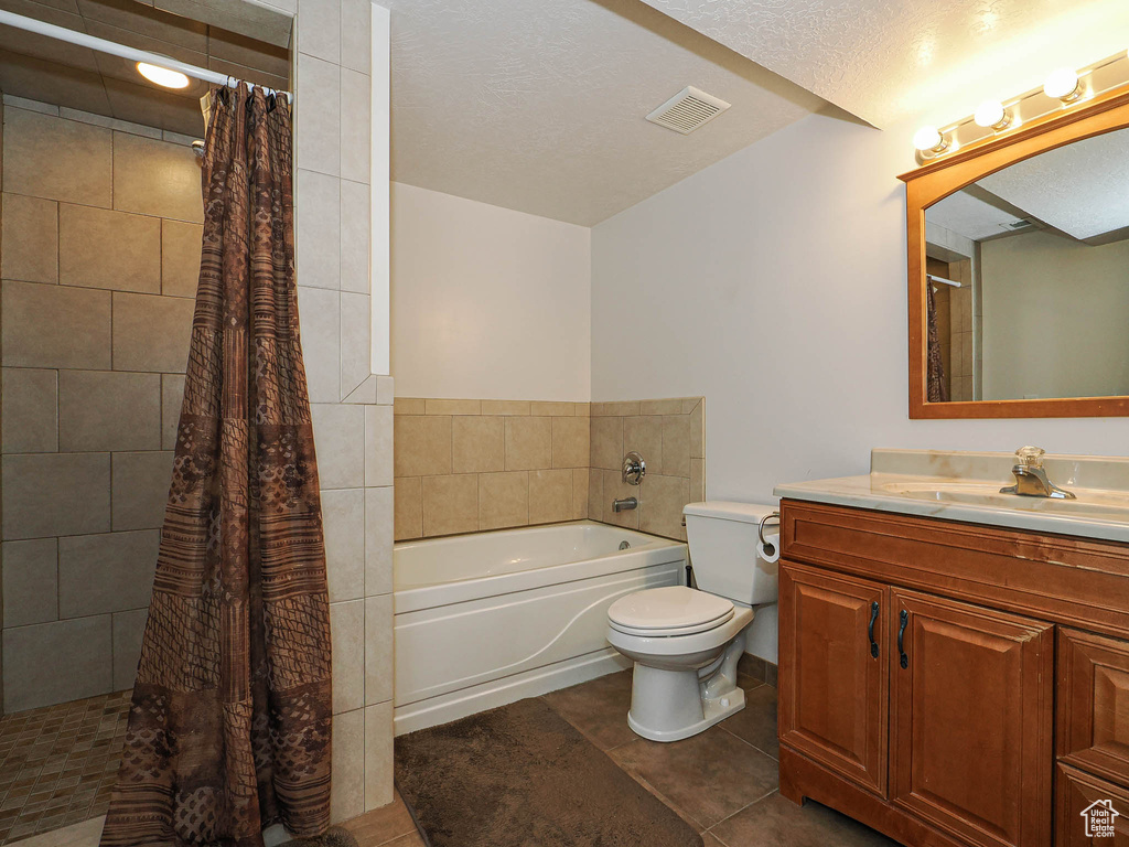Bathroom with a tile shower, tile patterned flooring, toilet, a bathtub, and visible vents