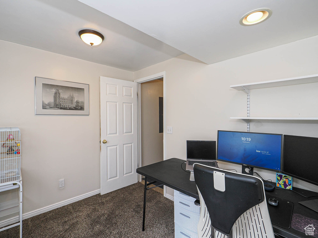Office space featuring baseboards and carpet flooring