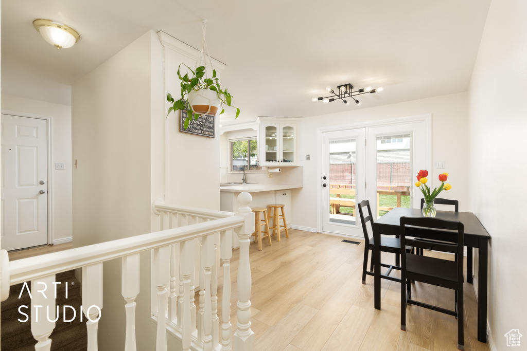 Dining area featuring baseboards and light wood finished floors