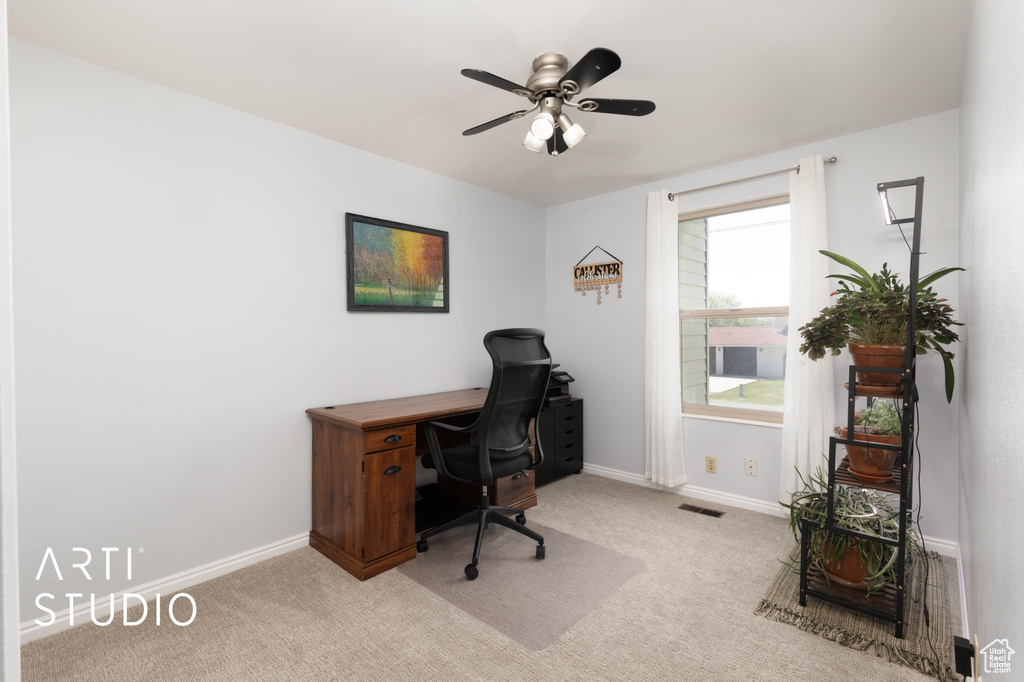 Office with baseboards, carpet, a ceiling fan, and visible vents