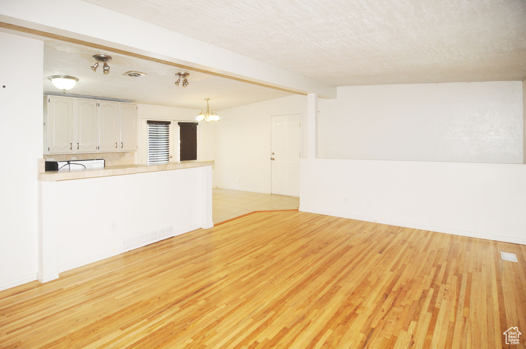 Interior space featuring a chandelier and visible vents