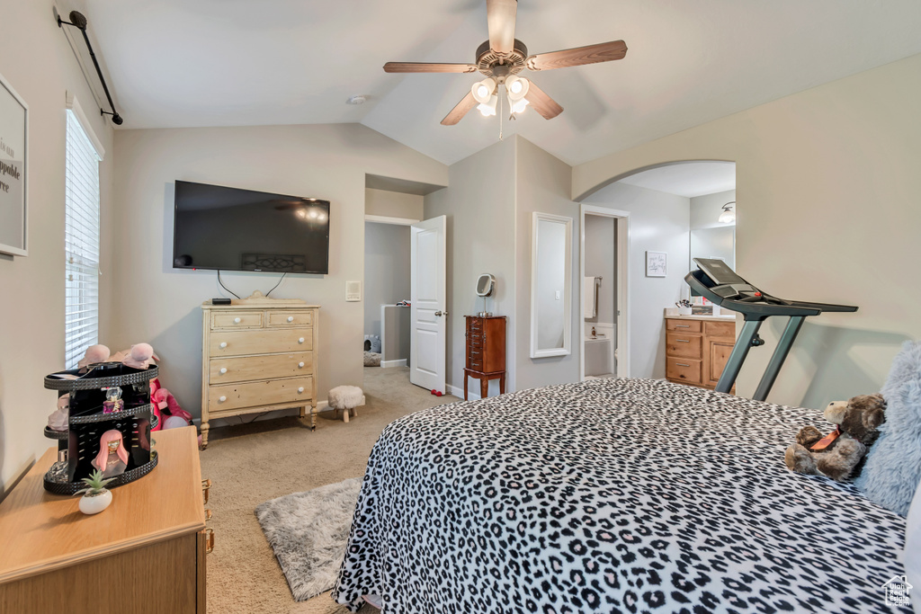 Bedroom with arched walkways, carpet, a ceiling fan, baseboards, and lofted ceiling