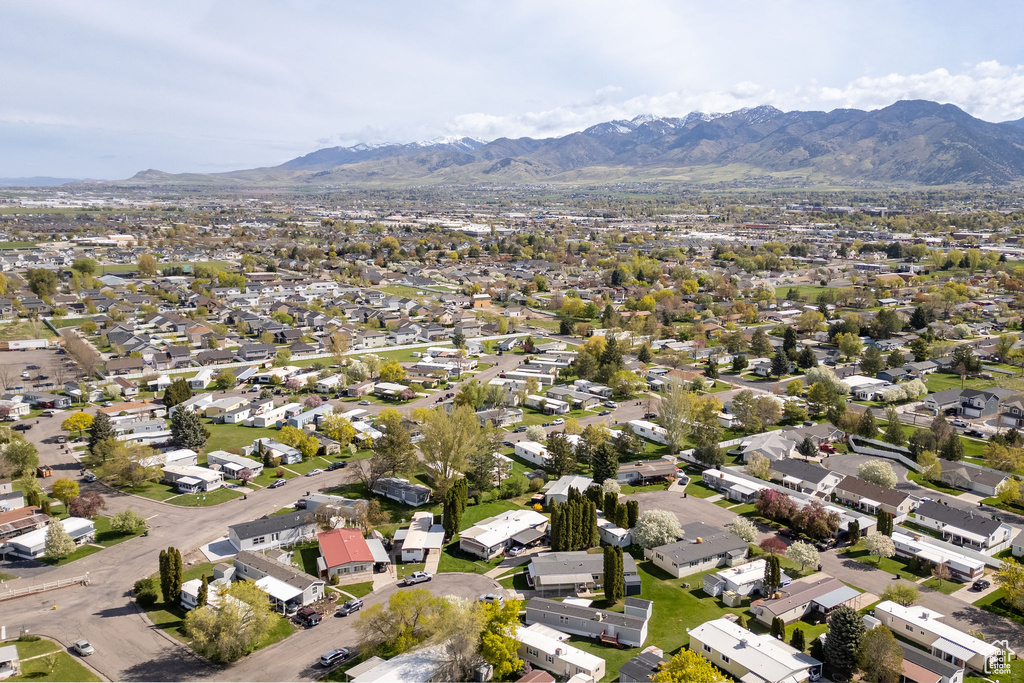 Birds eye view of property with a residential view and a mountain view