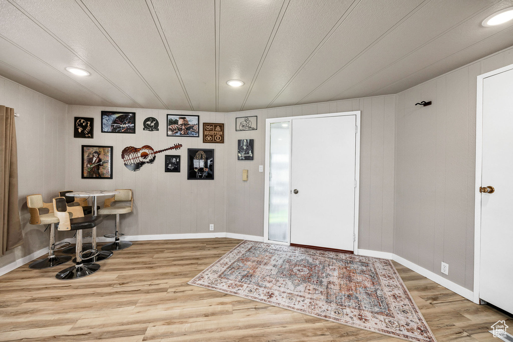 Entryway featuring baseboards, recessed lighting, and wood finished floors