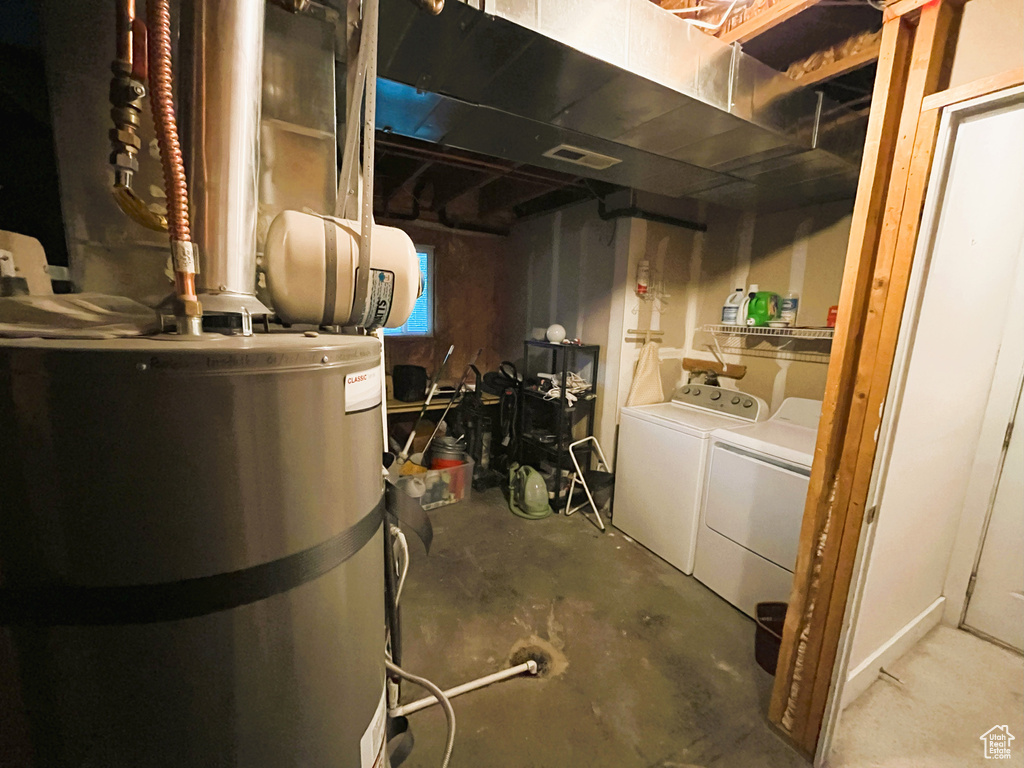 Unfinished basement with water heater and independent washer and dryer