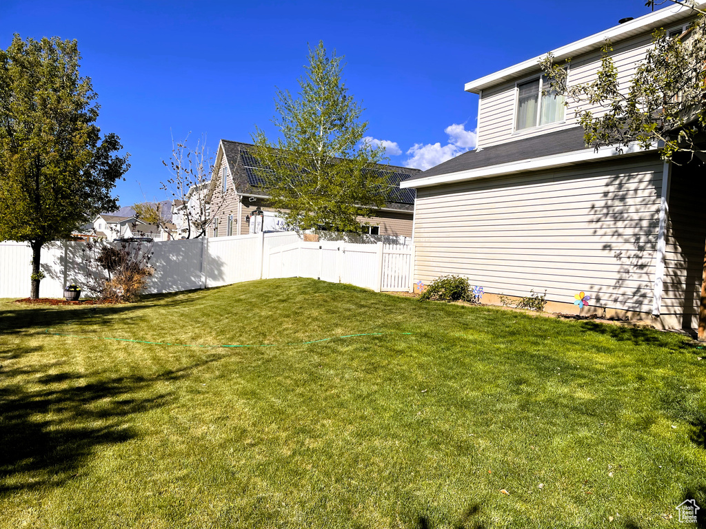View of yard featuring fence