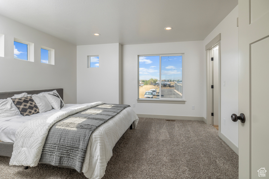 Bedroom featuring carpet flooring, recessed lighting, and baseboards