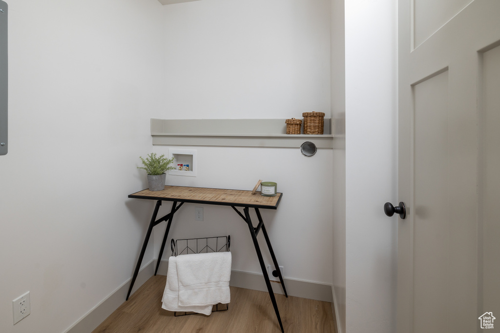 Office area featuring baseboards and wood finished floors