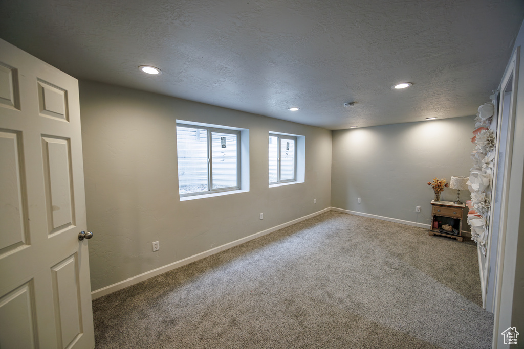 Below grade area featuring carpet flooring, recessed lighting, and baseboards